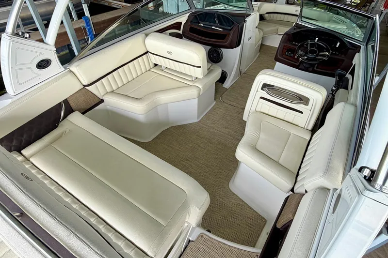 Slide: The Image of Luxurious interior of a 2017 Cobalt A25 boat with cream leather seating. - 34