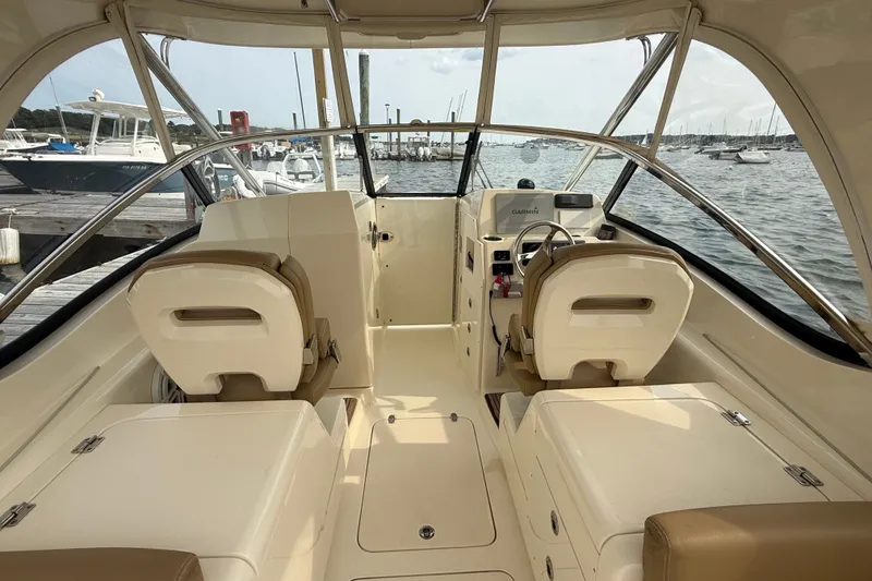 Slide: The Image of Interior view of a 2018 Scout 275 Dorado boat at a marina. - 13