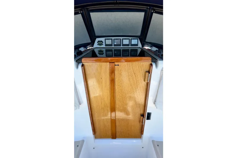 Slide: The Image of 2001 J Boats J/32 cockpit with wooden hatch and navigation instruments. - 56