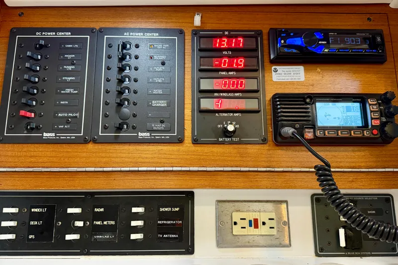 Slide: The Image of Control panel of a 2001 J Boats J/32, featuring power and communication systems. - 22