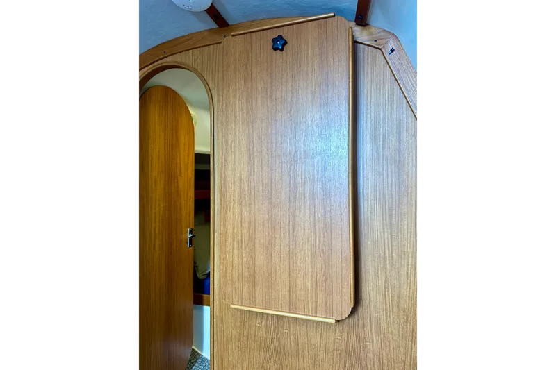 Slide: The Image of Interior view of 2001 J Boats J/32, featuring wooden cabinetry and door. - 21