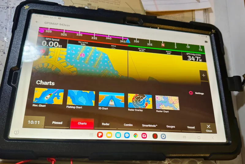 Slide: The Image of Tablet displaying GPS navigation charts for a 2001 J Boats J/32 sailboat. - 25