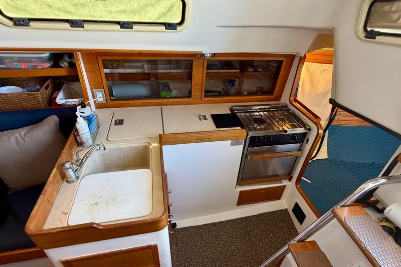 Slide: The Image of Interior of a 2001 J Boats J/32 sailboat galley with sink and stove. - 17