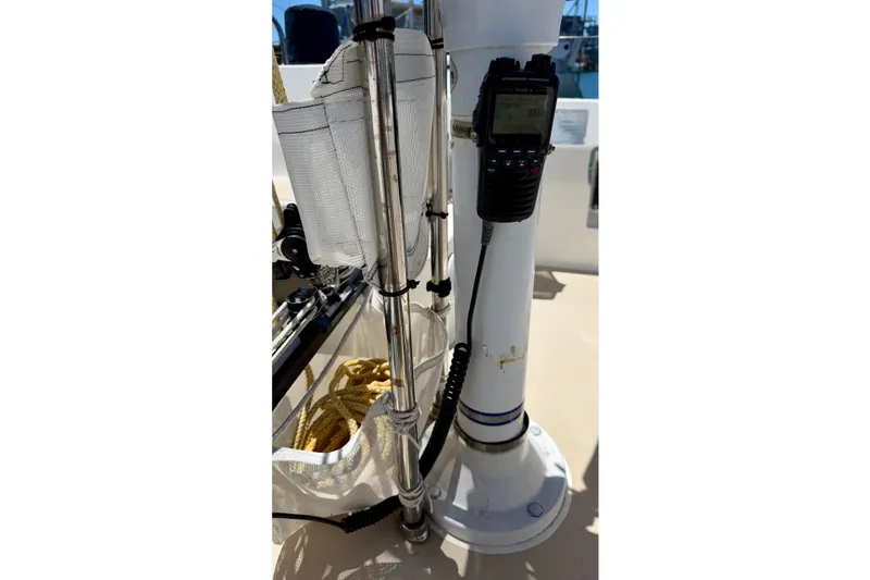 Slide: The Image of Close-up of a 2001 J Boats J/32 sailboat cockpit with radio and rigging. - 44