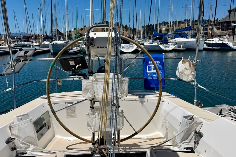 Slide: The Image of Cockpit view of a 2001 J Boats J/32 sailboat docked in a marina. - 55
