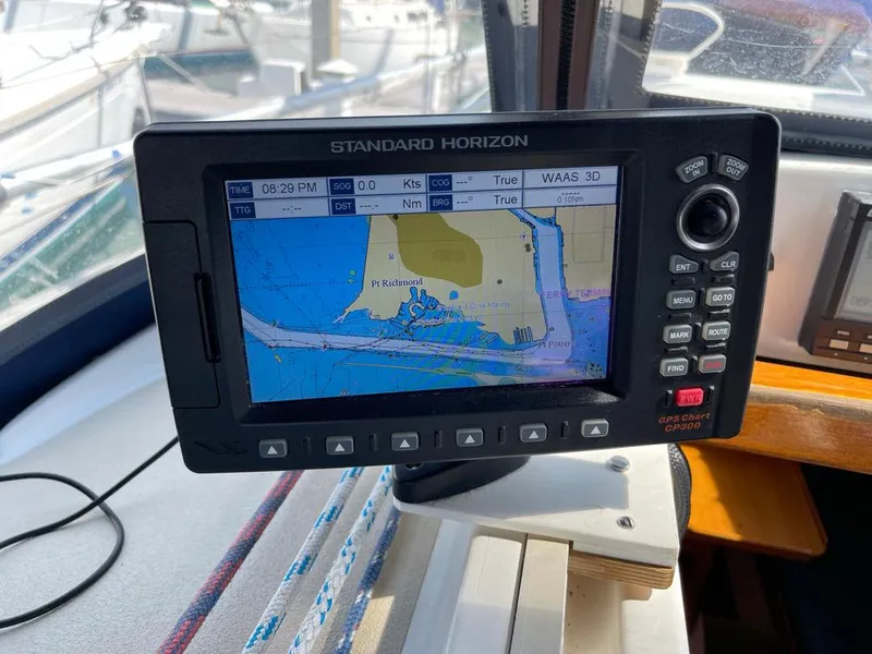 Slide: The Image of A Standard Horizon navigation system displays a nautical chart aboard a J/32 boat. - 39
