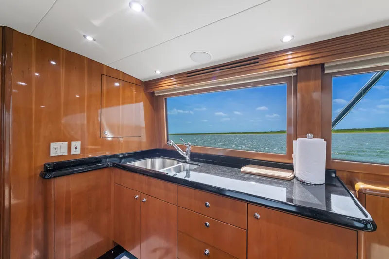 Slide: The Image of Luxurious kitchen interior of 2003 Hatteras 60 Convertible yacht with ocean view. - 28