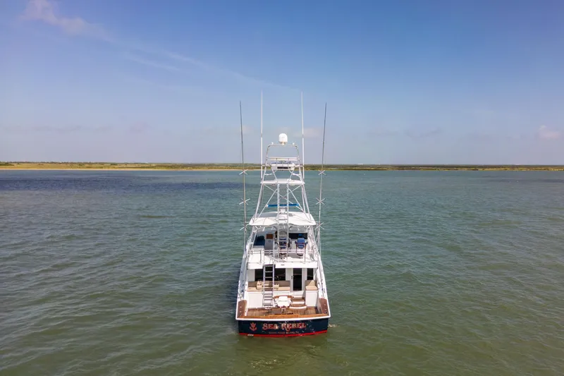 Slide: The Image of Aerial view of 2003 Hatteras 60 Convertible yacht on calm waters. - 3