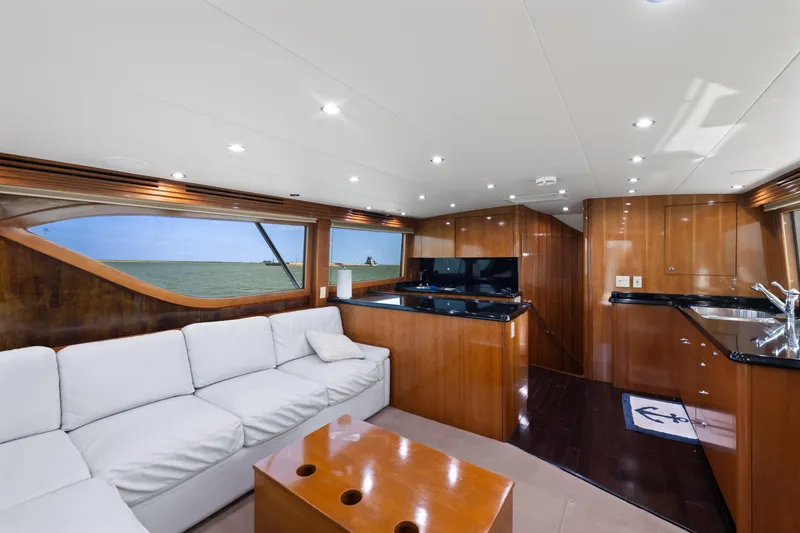 Slide: The Image of Luxurious interior of 2003 Hatteras 60 Convertible yacht with elegant wood finishes and modern amenities. - 19