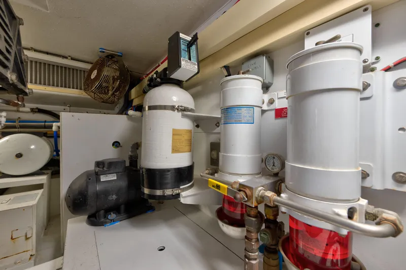 Slide: The Image of Engine room of 2003 Hatteras 60 Convertible yacht with mechanical equipment. - 44