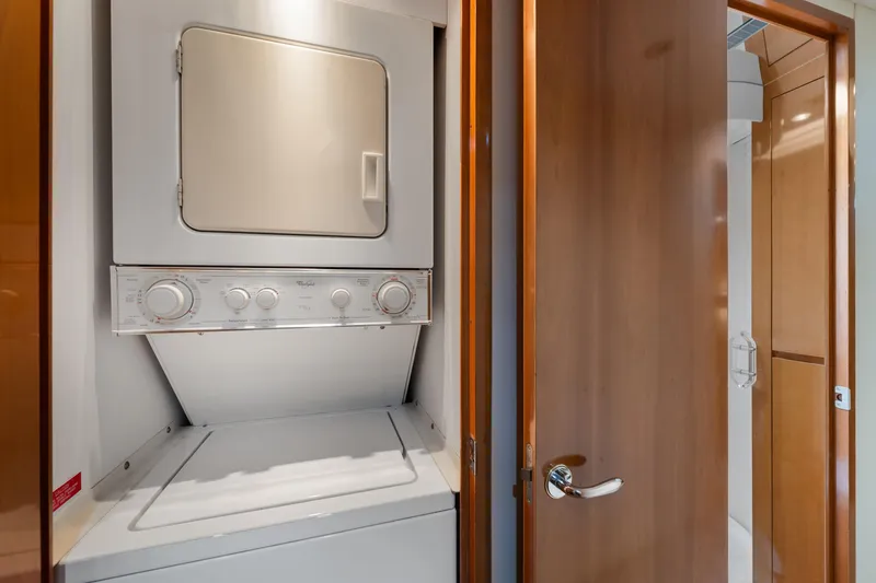 Slide: The Image of Stacked washer and dryer in 2003 Hatteras 60 Convertible yacht interior. - 36