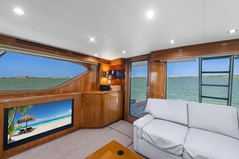 Slide: The Image of Luxurious interior of 2003 Hatteras 60 Convertible yacht with scenic ocean views. - 22