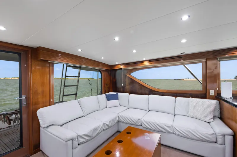 Slide: The Image of Luxurious interior of 2003 Hatteras 60 Convertible yacht with plush seating and ocean view. - 20