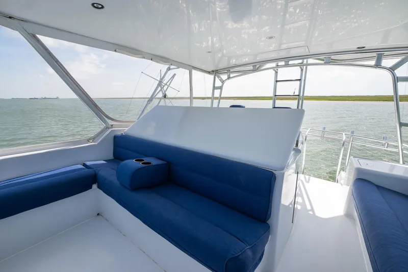 Slide: The Image of Luxurious seating area on 2003 Hatteras 60 Convertible yacht with ocean view. - 9