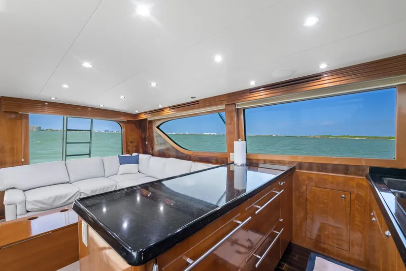Slide: The Image of Luxurious interior of 2003 Hatteras 60 Convertible yacht with ocean view and modern furnishings. - 26