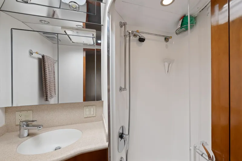 Slide: The Image of Bathroom interior of 2003 Hatteras 60 Convertible yacht with shower and sink. - 35