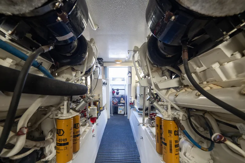 Slide: The Image of Engine room of 2003 Hatteras 60 Convertible yacht, showcasing machinery and equipment. - 45