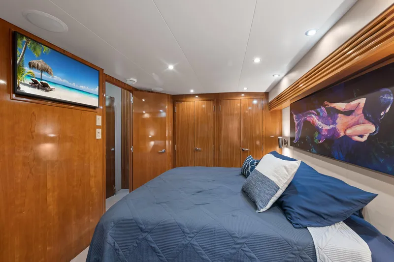 Slide: The Image of Luxurious cabin interior of 2003 Hatteras 60 Convertible yacht with elegant wood paneling. - 31
