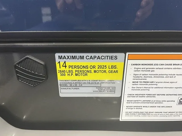 Slide: The Image of A sign on a boat shows maximum capacities: 14 persons or 2025 lbs, with a 300 HP motor. - 10