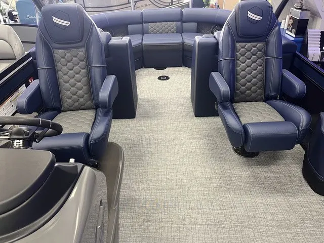 Slide: The Image of The image shows the interior of a South Bay 525RS 3.0 boat with luxurious blue seating. - 5