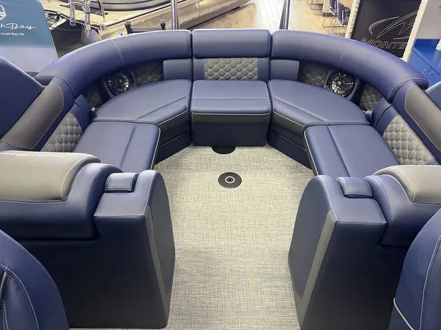 Slide: The Image of Luxurious, cushioned seating in a modern boat with blue and gray accents. - 4