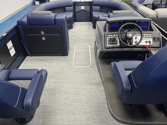 Slide: The Image of The image shows the interior of a modern pontoon boat with blue seating and a sleek helm. - 7