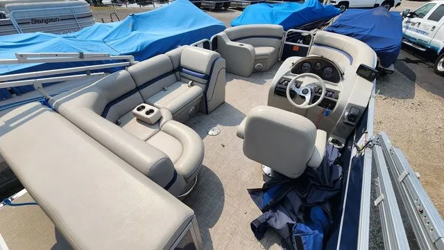 Slide: The Image of The image shows the interior of a 2017 Berkshire 17CL 2.0 pontoon boat with beige seating. - 5