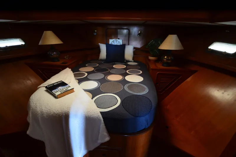 Slide: The Image of Cozy cabin interior of 1985 Kha Shing 40 yacht with circular-patterned bedding. - 32