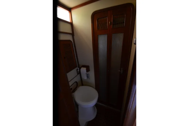 Slide: The Image of Compact bathroom interior of 1985 Kha Shing 40 yacht with wooden accents. - 36