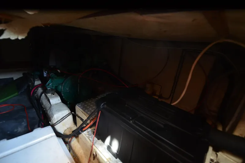 Slide: The Image of Engine room of a 1985 Kha Shing 40 yacht, featuring wiring and machinery. - 40