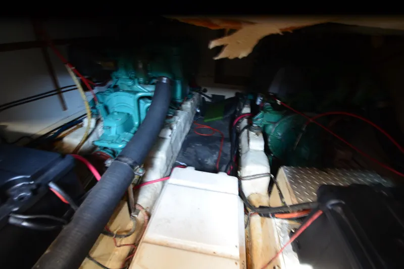 Slide: The Image of Engine room of a 1985 Kha Shing 40 yacht, featuring mechanical components and wiring. - 38