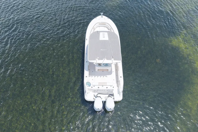 Slide: The Image of Overhead view of 2018 Robalo R302 Center Console boat on clear water. - 6