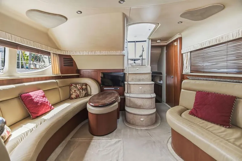 Slide: The Image of Luxurious interior of 2006 Sea Ray 40 Motor Yacht with plush seating and elegant decor. - 11