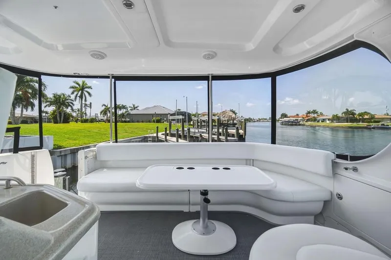 Slide: The Image of Luxurious 2006 Sea Ray 40 Motor Yacht interior with waterfront view and elegant seating area. - 8