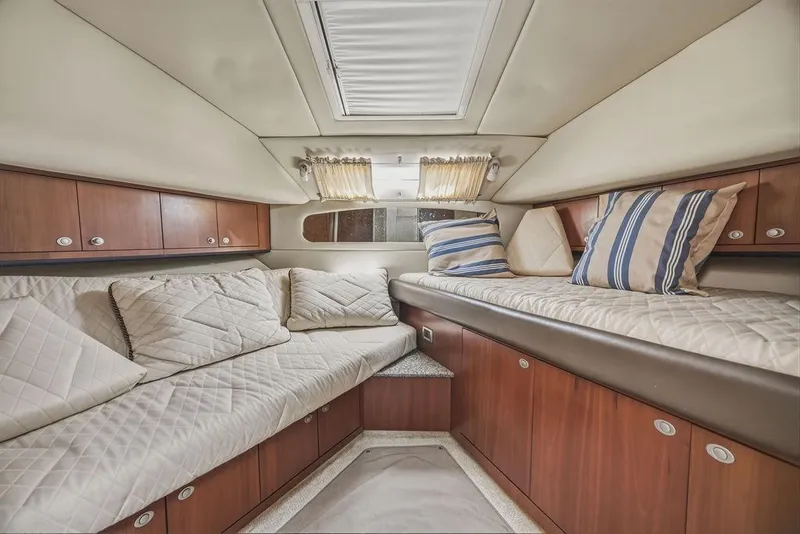 Slide: The Image of Luxurious interior of 2006 Sea Ray 40 Motor Yacht with cozy seating and elegant wood finish. - 19