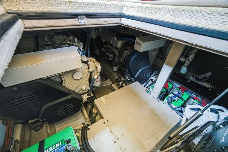 Slide: The Image of Engine room of a 2006 Sea Ray 40 Motor Yacht, showcasing mechanical components and batteries. - 20