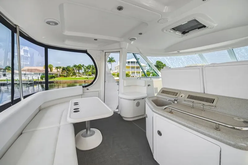 Slide: The Image of Interior of a 2006 Sea Ray 40 Motor Yacht with seating and kitchenette. - 6