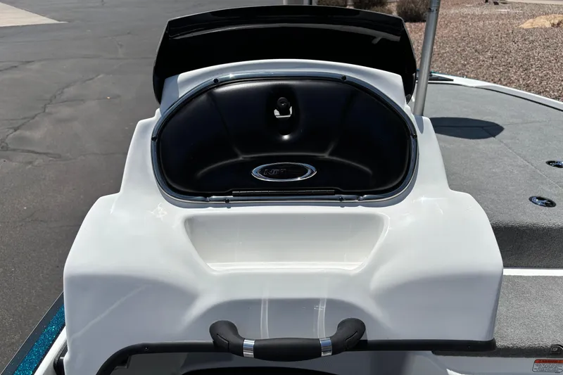 Slide: The Image of 2027 Nitro Z17 boat storage compartment with open lid on a sunny day. - 10