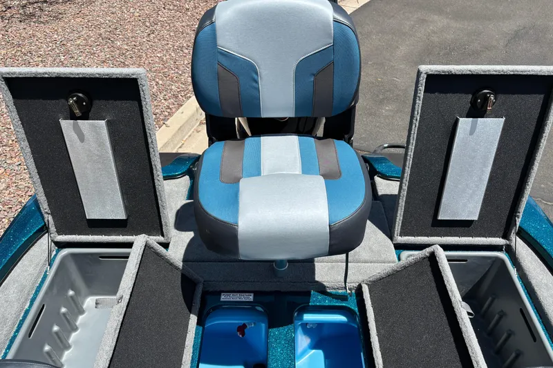 Slide: The Image of Nitro Z17 2027 boat interior with blue seat and open storage compartments. - 13