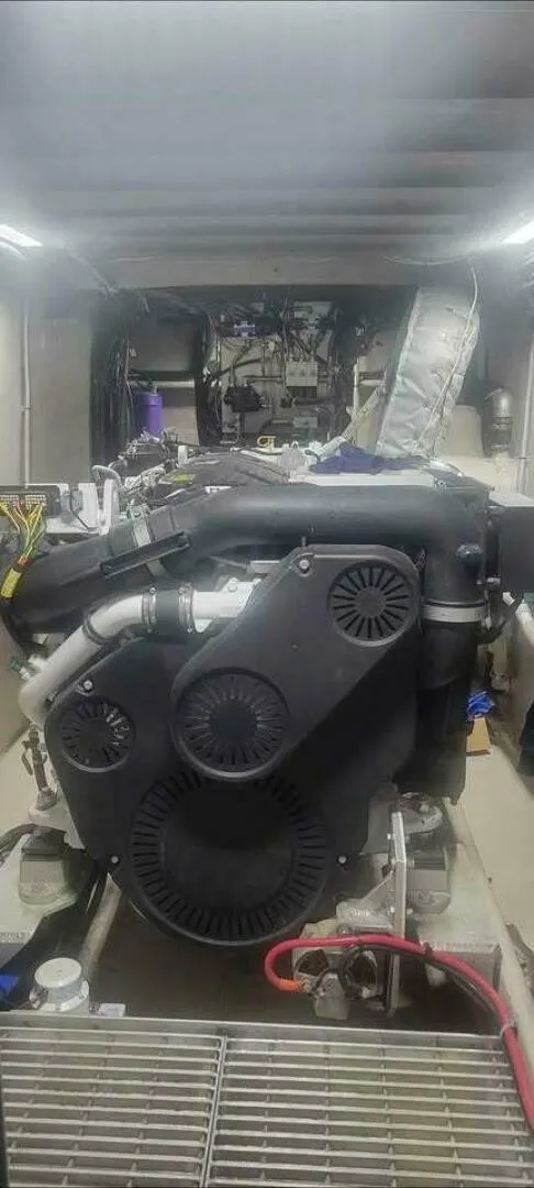Slide: The Image of A powerful engine inside a boat, surrounded by various cables and components. - 22