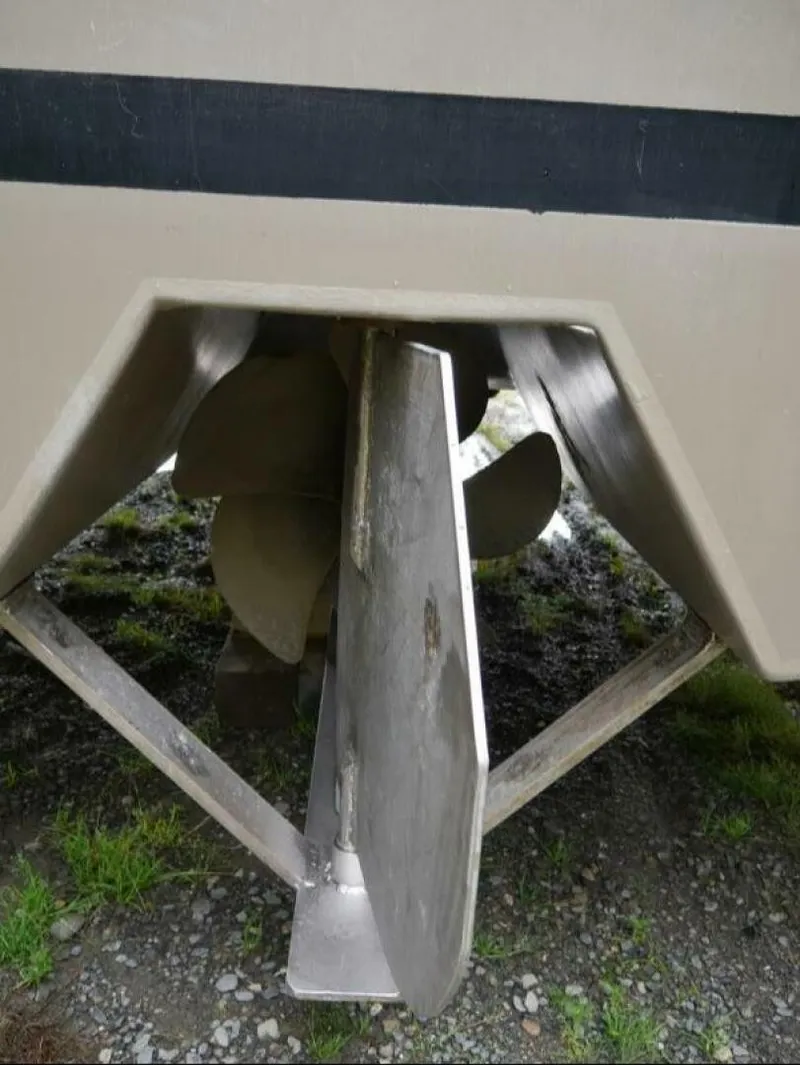 Slide: The Image of Close-up of a boat propeller and rudder on a 2022 Freestyle Marine 32. - 15