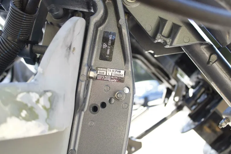 Slide: The Image of Close-up of a boat engine with visible parts and serial numbers. - 20