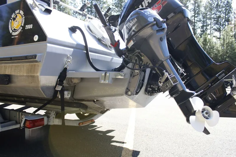 Slide: The Image of An outboard motor is mounted on the stern of a boat, which is on a trailer. - 17