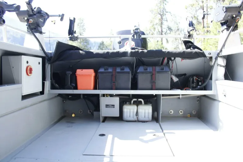 Slide: The Image of The image shows the stern of a boat with multiple fishing rod holders and storage space. - 29