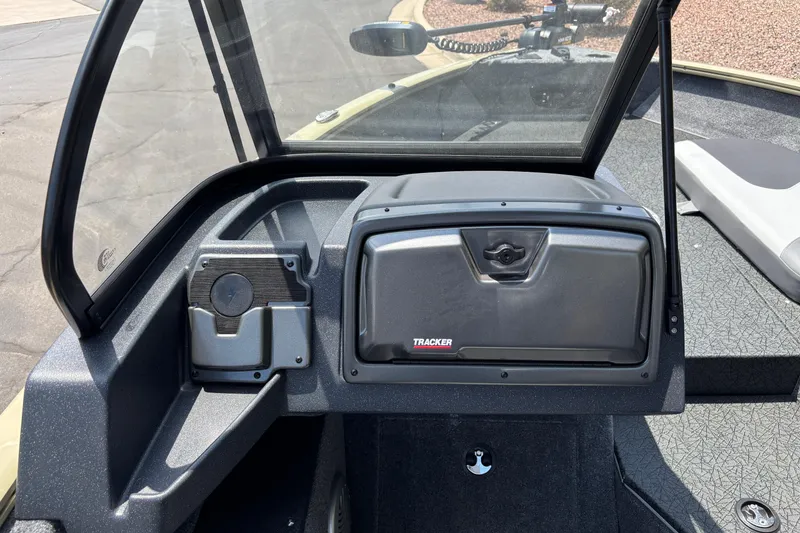 Slide: The Image of 2027 Tracker Pro Guide V-175 Combo boat dashboard with windshield and storage compartment. - 5