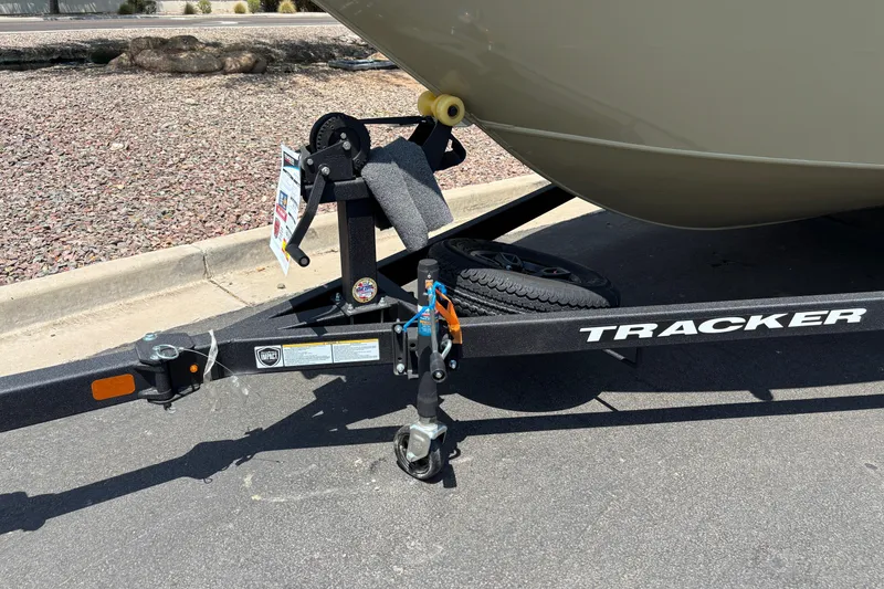 Slide: The Image of Trailer hitch of 2027 Tracker Pro Guide V-175 Combo boat on pavement. - 2