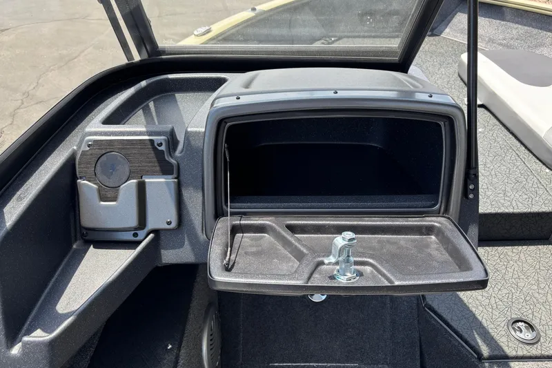 Slide: The Image of 2027 Tracker Pro Guide V-175 Combo boat interior with storage compartment and cup holder. - 6