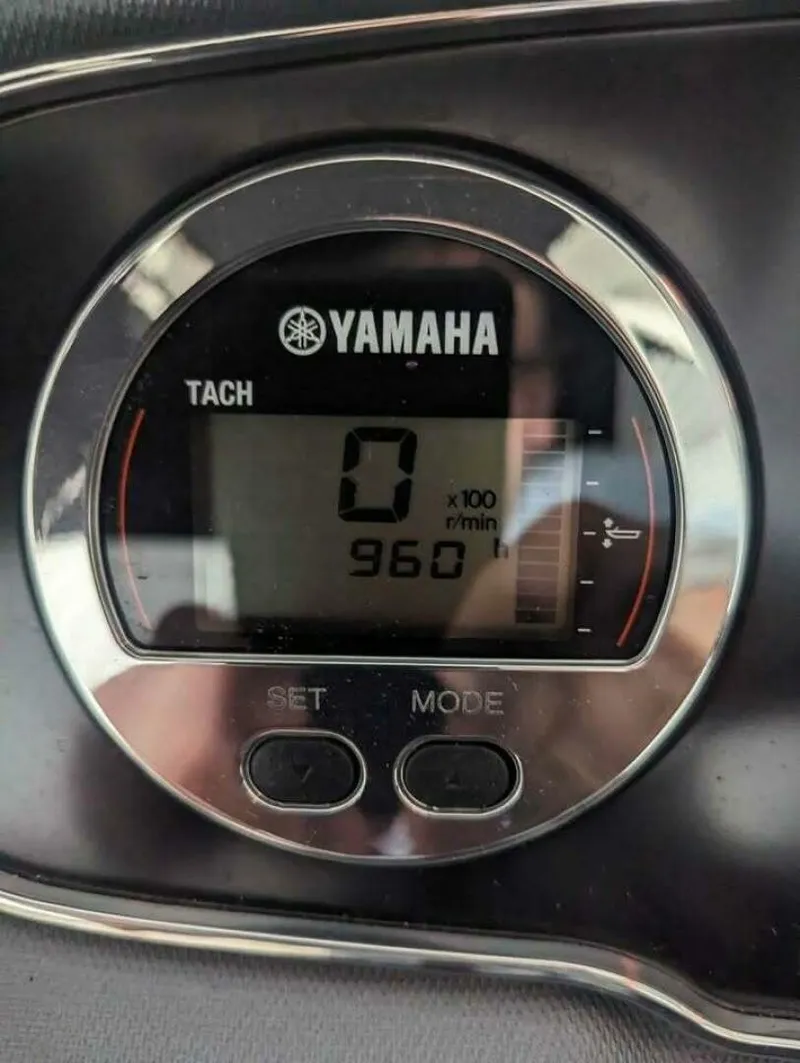Slide: The Image of A Yamaha tachometer displays 960 RPM. It features a digital screen and control buttons. - 11