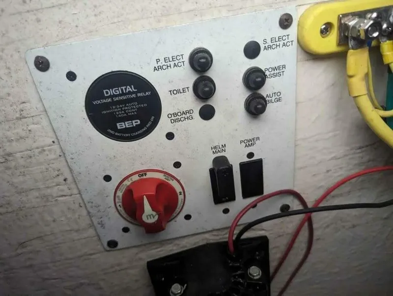Slide: The Image of Electrical control panel with switches and indicators on a boat. - 19