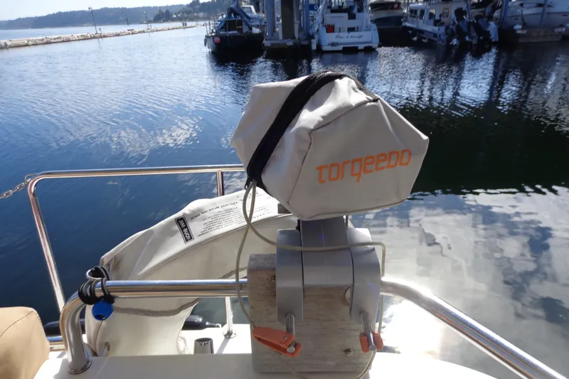 Slide: The Image of 2016 Ranger Tugs R-31 S with Torqeedo motor cover at marina. - 39